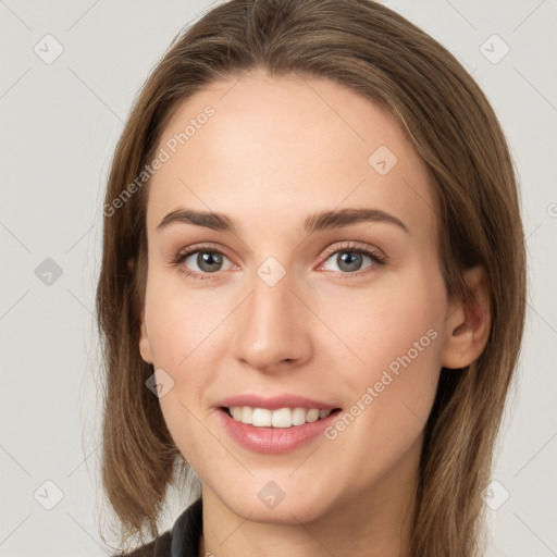 Joyful white young-adult female with long  brown hair and grey eyes