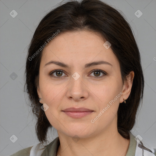 Joyful white young-adult female with medium  brown hair and brown eyes