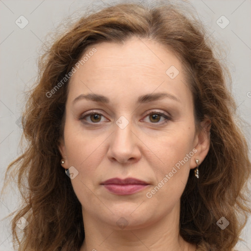 Joyful white adult female with long  brown hair and brown eyes