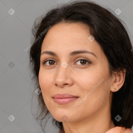 Joyful white adult female with medium  brown hair and brown eyes