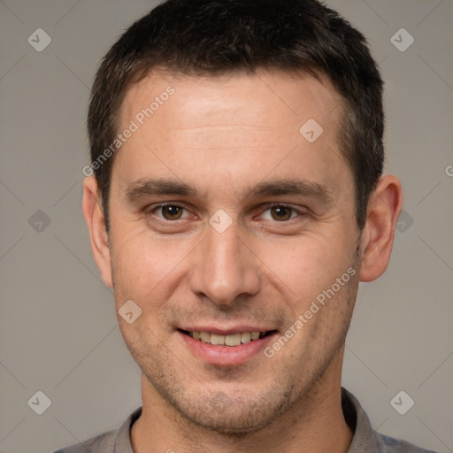 Joyful white young-adult male with short  brown hair and brown eyes