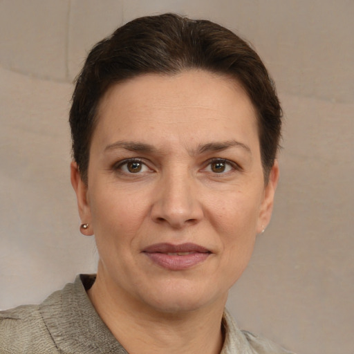 Joyful white adult female with short  brown hair and brown eyes