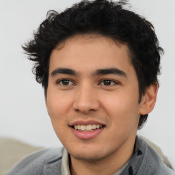 Joyful latino young-adult male with short  brown hair and brown eyes