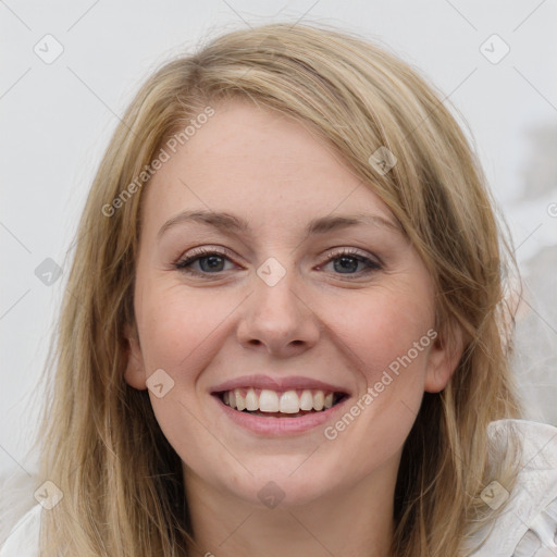 Joyful white young-adult female with medium  brown hair and blue eyes