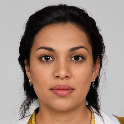 Joyful latino young-adult female with medium  black hair and brown eyes