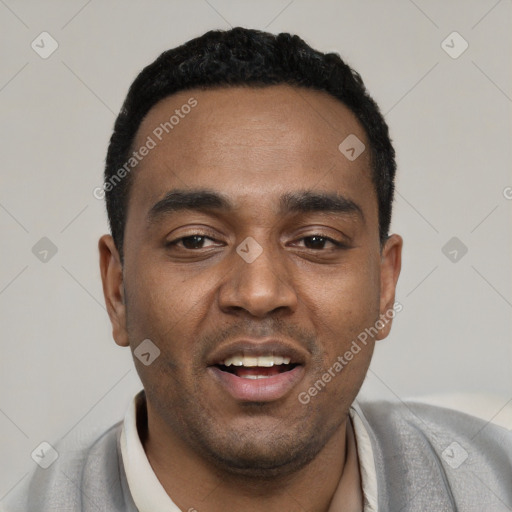 Joyful black young-adult male with short  black hair and brown eyes