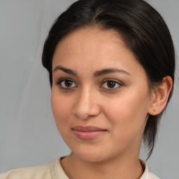 Joyful white young-adult female with medium  brown hair and brown eyes