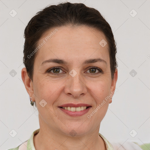 Joyful white adult female with short  brown hair and brown eyes