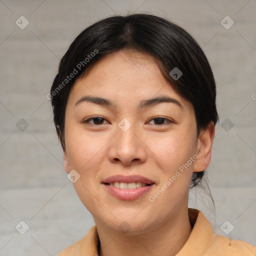 Joyful asian young-adult female with short  brown hair and brown eyes