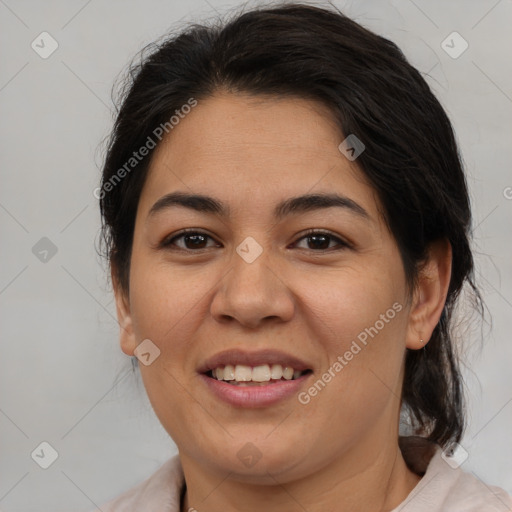 Joyful latino young-adult female with medium  brown hair and brown eyes