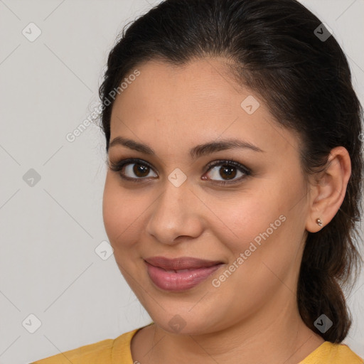 Joyful latino young-adult female with medium  brown hair and brown eyes