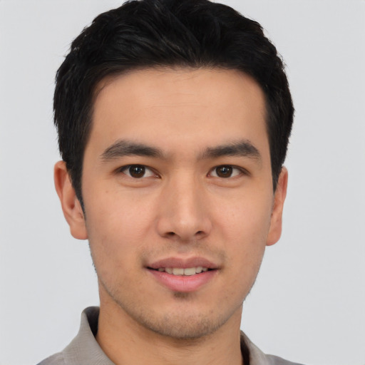 Joyful asian young-adult male with short  black hair and brown eyes