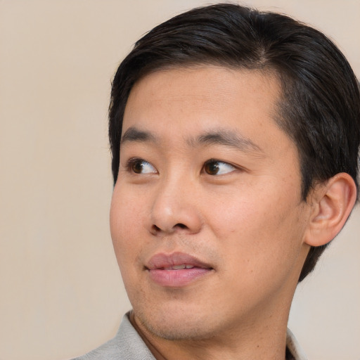 Neutral asian young-adult male with short  brown hair and brown eyes