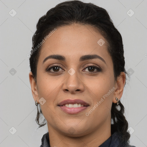 Joyful latino young-adult female with medium  brown hair and brown eyes