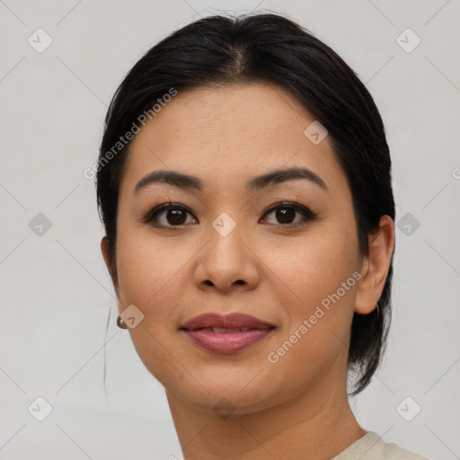 Joyful asian young-adult female with medium  brown hair and brown eyes