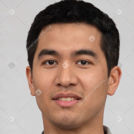 Joyful latino young-adult male with short  black hair and brown eyes