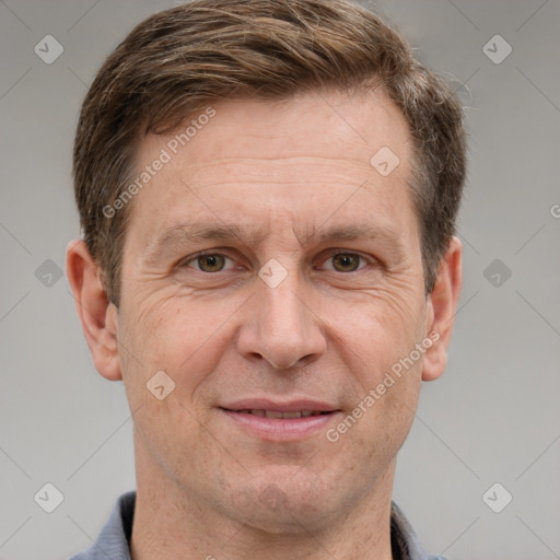 Joyful white adult male with short  brown hair and grey eyes