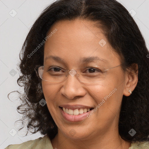 Joyful black adult female with medium  brown hair and brown eyes