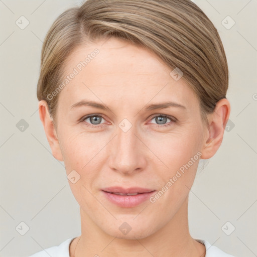 Joyful white young-adult female with short  brown hair and grey eyes