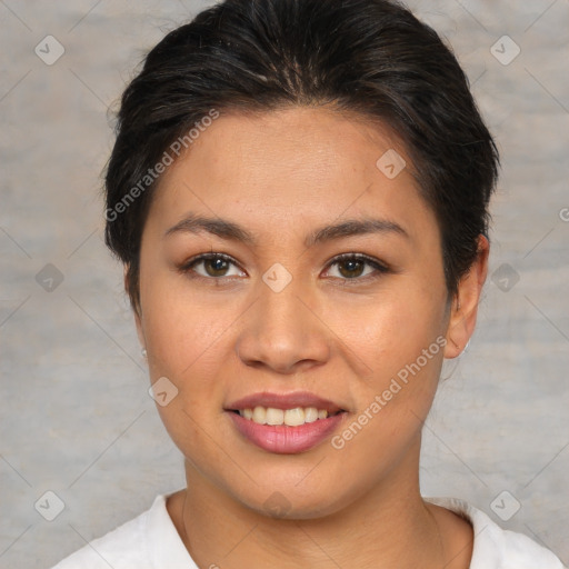 Joyful asian young-adult female with short  brown hair and brown eyes