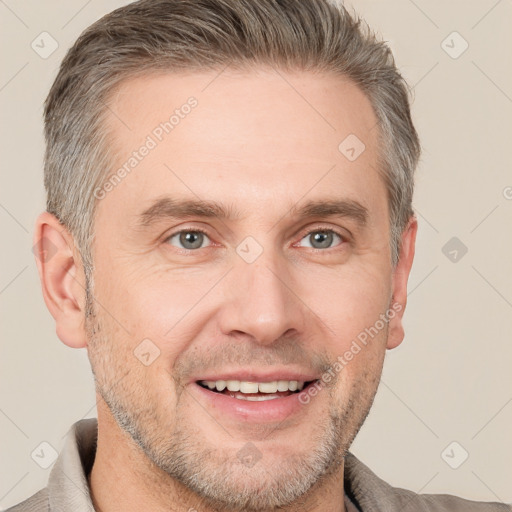 Joyful white adult male with short  brown hair and grey eyes