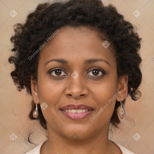 Joyful black young-adult female with long  brown hair and brown eyes