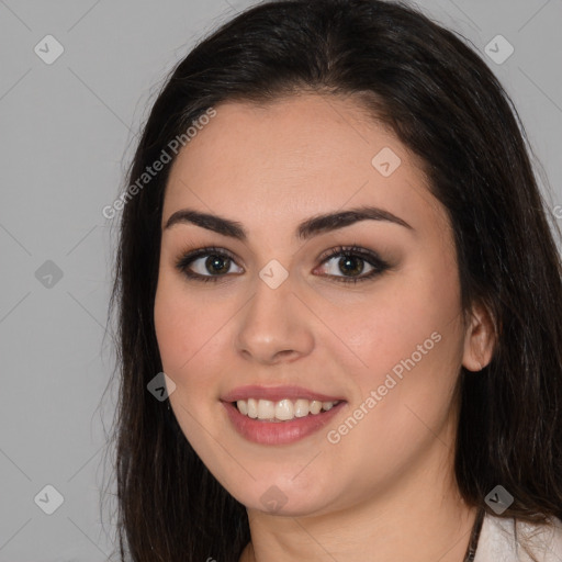 Joyful white young-adult female with long  brown hair and brown eyes