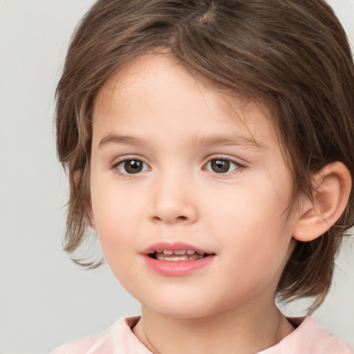 Joyful white child female with medium  brown hair and brown eyes