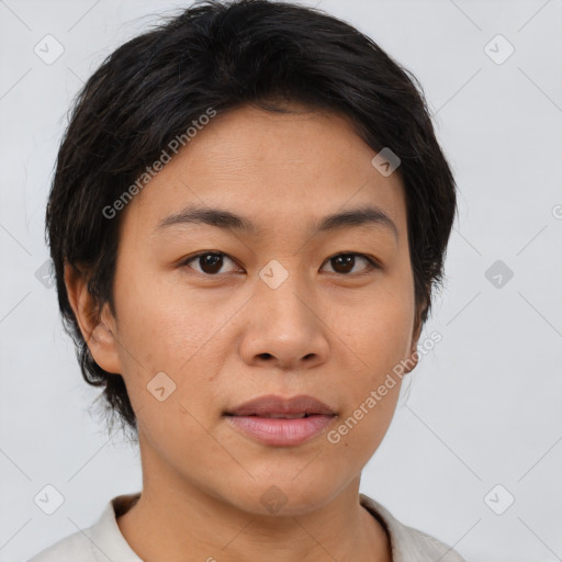 Joyful asian young-adult female with short  brown hair and brown eyes