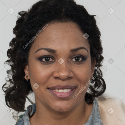 Joyful black adult female with medium  brown hair and brown eyes