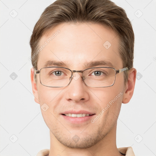 Joyful white adult male with short  brown hair and grey eyes