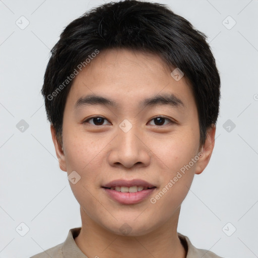 Joyful asian young-adult male with short  black hair and brown eyes