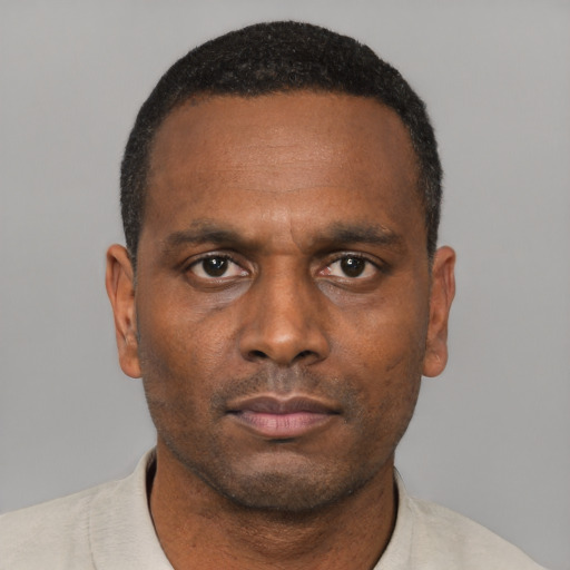 Neutral black adult male with short  black hair and brown eyes