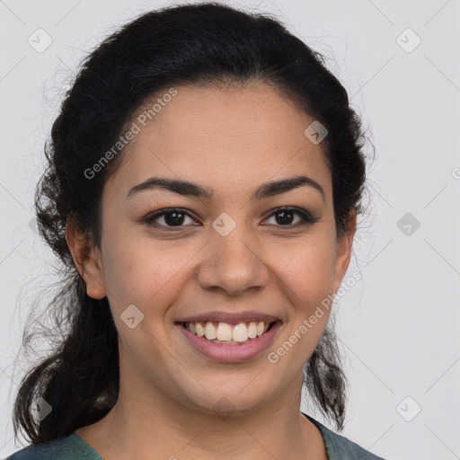 Joyful latino young-adult female with medium  brown hair and brown eyes