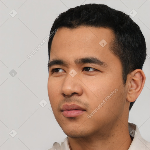 Neutral latino young-adult male with short  black hair and brown eyes
