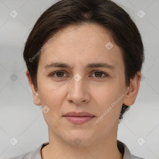 Joyful white young-adult female with short  brown hair and brown eyes