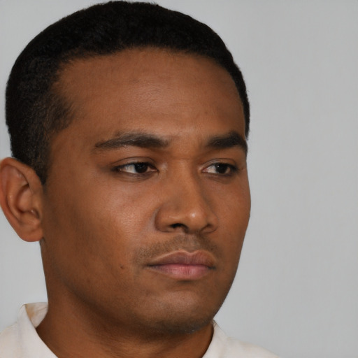 Neutral black young-adult male with short  brown hair and brown eyes