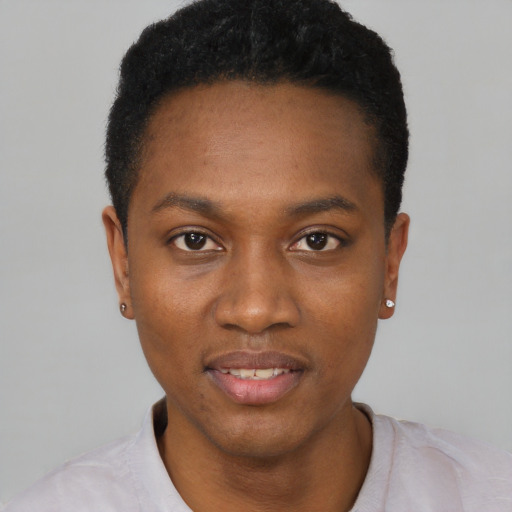 Joyful black young-adult female with short  black hair and brown eyes