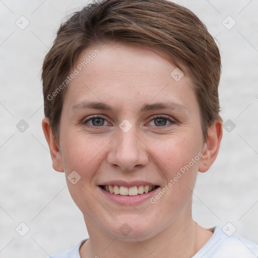 Joyful white young-adult female with short  brown hair and grey eyes