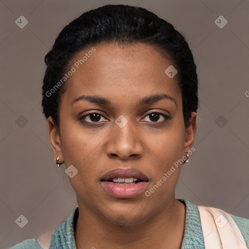 Joyful black young-adult female with short  black hair and brown eyes