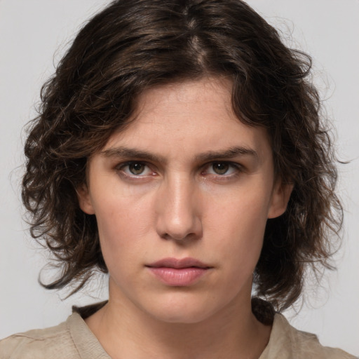 Neutral white young-adult female with medium  brown hair and green eyes