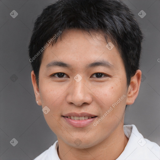 Joyful asian young-adult male with short  brown hair and brown eyes