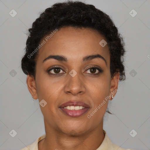 Joyful black young-adult female with short  brown hair and brown eyes