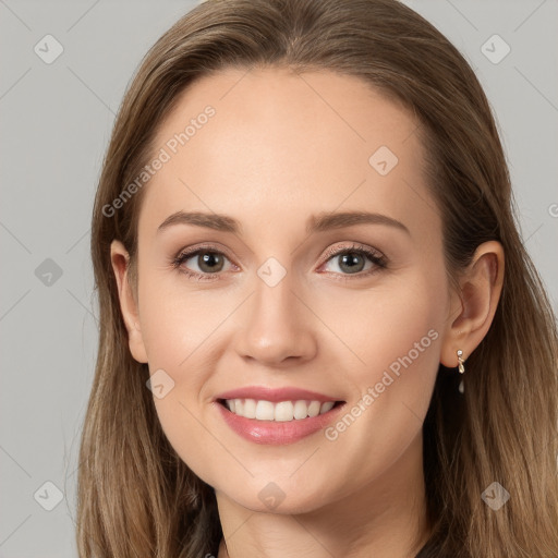 Joyful white young-adult female with long  brown hair and grey eyes