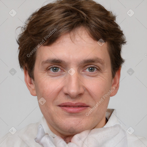 Joyful white adult male with short  brown hair and grey eyes