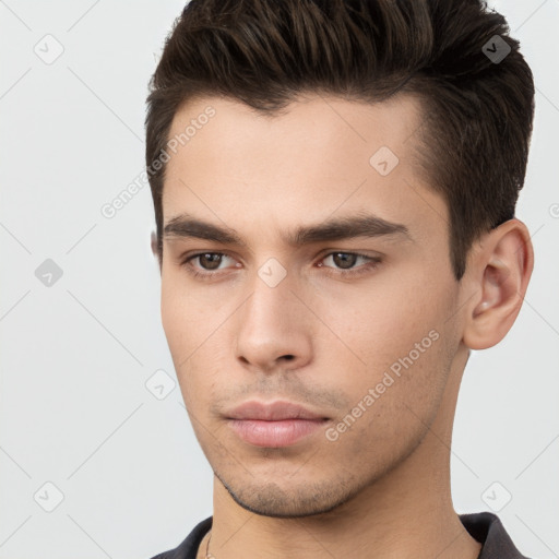 Neutral white young-adult male with short  brown hair and brown eyes