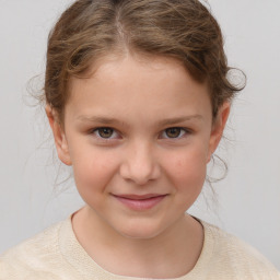 Joyful white child female with short  brown hair and brown eyes