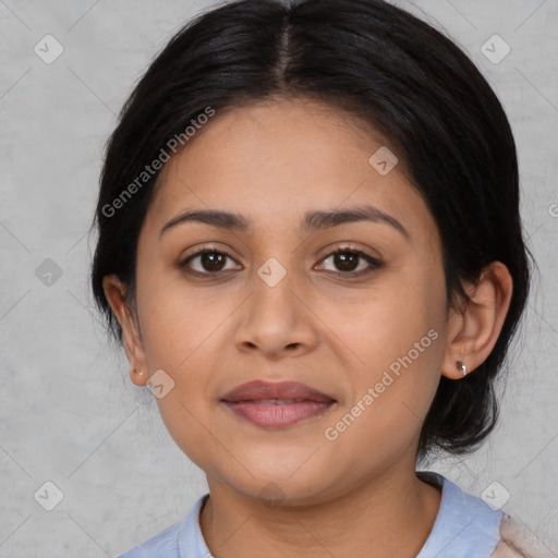 Joyful latino young-adult female with medium  black hair and brown eyes