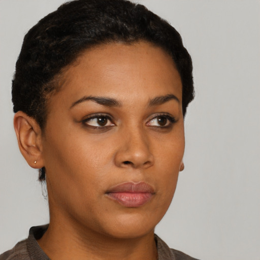 Neutral black young-adult female with short  brown hair and brown eyes