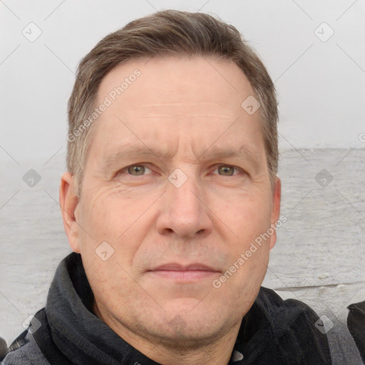 Joyful white adult male with short  brown hair and grey eyes